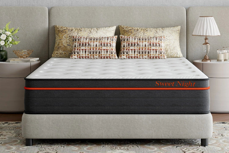 Sweet Night mattress on a bed with decorative pillows and side tables.