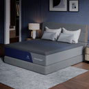 Angled view of the CoolNest Pro memory foam mattress on a gray foundation in a navy bedroom #Thickness_12,14,16