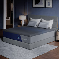 Angled view of the CoolNest Pro memory foam mattress on a gray foundation in a navy bedroom #Thickness_12,14,16